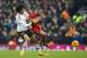 Marouane Fellaini in action against Liverpool's Jordan Henderson.