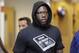 New York Giants NFL football player Jason Pierre-Paul walks through the team locker room in East Rutherford, N.J., Monday, Jan. 4, 2016. The final game for the Giants was much like many others this season. New York had its chances and squandered them in a 35-50 loss to the Philadelphia Eagles on Sunday. (AP Photo/Seth Wenig)