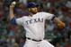 Texas Rangers starting pitcher Colby Lewis works against the Detroit Tigers in the first inning of a baseball game Monday Sept. 28, 2015, in Arlington, Texas. (AP Photo/Ron Jenkins)