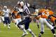 New England Patriots tight end Rob Gronkowski (87) breaks free from Denver Broncos strong safety T.J. Ward (43) for a touchdown during the first half of an NFL football game, Sunday, Nov. 29, 2015, in Denver. (AP Photo/Jack Dempsey)