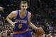 New York Knicks' Kristaps Porzingis dribbles during the first half of an NBA basketball game against the Milwaukee Bucks Saturday, Dec. 5, 2015, in Milwaukee. (AP Photo/Aaron Gash)