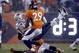 New England Patriots tight end Rob Gronkowski (87) is up-ended by Denver Broncos free safety Darian Stewart as free safety Bradley Roby (29) looks on during the first half of an NFL football game, Sunday, Nov. 29, 2015, in Denver. (AP Photo/Joe Mahoney)