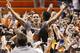 Oklahoma State guard Jeffrey Carroll (30) celebrates with fans after Oklahoma State defeated Kansas in an NCAA college basketball game in Stillwater, Okla., Tuesday, Jan. 19, 2016. Oklahoma State won 86-67. (AP Photo/Sue Ogrocki)