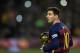 Barcelona's Argentinian forward Lionel Messi walks away after posing with his fifth Ballon d'Or trophy before the Spanish league football match FC Barcelona vs Athletic Club Bilbao at the Camp Nou stadium in Barcelona on January 17, 2016. / AFP / LLUIS GENE (Photo credit should read LLUIS GENE/AFP/Getty Images)