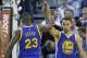 Golden State Warriors' Draymond Green (23) high-fives Golden State Warriors guard Stephen Curry (30) in the second half during an NBA basketball game against the Utah Jazz Monday, Nov. 30, 2015, in Salt Lake City. Warriors won 106-103. (AP Photo/Rick Bowmer)