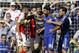 Arsenal's Brazilian defender Gabriel (L) and Chelsea's Brazilian-born Spanish striker Diego Costa (2nd R) are separated by Arsenal's Czech goalkeeper Petr Cech (C) as they clash during the English Premier League football match between Chelsea and Arsenal at Stamford Bridge in London on September 19, 2015. AFP PHOTO / IAN KINGTON RESTRICTED TO EDITORIAL USE. No use with unauthorized audio, video, data, fixture lists, club/league logos or 'live' services. Online in-match use limited to 75 images, no video emulation. No use in betting, games or single club/league/player publications. (Photo credit should read IAN KINGTON/AFP/Getty Images)