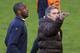 Inter Milan manager Jose Mourinho, right, throws the ball in the air for Patrick Vieira, left, during their training session at Old Trafford Stadium, ahead of their Champions League second round second leg soccer match against Manchester United, Manchester, England, Tuesday, March 10, 2009. (AP Photo/Scott Heppell)