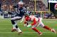 FOXBORO, MA - JANUARY 16: Tom Brady #12 of the New England Patriots runs for the end zone against Husain Abdullah #39 of the Kansas City Chiefs in the first half during the AFC Divisional Playoff Game at Gillette Stadium on January 16, 2016 in Foxboro, Massachusetts. (Photo by Al Bello/Getty Images)