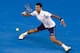 Novak Djokovic of Serbia hits a forehand return during his fourth round match against Gilles Simon of France at the Australian Open tennis championships in Melbourne, Australia, Sunday, Jan. 24, 2016.(AP Photo/Rafiq Maqbool)