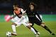 Shakhtar Donetsk's Brazilian midfielder Alex Teixeira (L) vies with Paris Saint-Germain's French midfielder Adrien Rabiot during the UEFA Champions League Group A football match between Paris-Saint-Germain and Shakhtar Donetsk on December 8, 2015 at the Parc des Princes stadium in Paris. AFP PHOTO / FRANCK FIFE / AFP / FRANCK FIFE (Photo credit should read FRANCK FIFE/AFP/Getty Images)