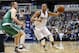 Boston Celtics forward Kelly Olynyk (41) defends as Dallas Mavericks guard Devin Harris (34) controls the ball during the first half of an NBA basketball game, Monday, Jan. 18, 2016, in Dallas. (AP Photo/Sharon Ellman)