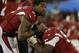 Arizona Cardinals' Patrick Peterson (21) consoles Frostee Rucker during the second half the NFL football NFC Championship game against the Carolina Panthers Sunday, Jan. 24, 2016, in Charlotte, N.C. (AP Photo/Bob Leverone)