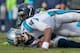 CHARLOTTE, NC - JANUARY 17: Frank Clark #55 of the Seattle Seahawks sacks Cam Newton #1 of the Carolina Panthers in the 4th quarter during the NFC Divisional Playoff Game at Bank of America Stadium on January 17, 2016 in Charlotte, North Carolina. (Photo by Grant Halverson/Getty Images)