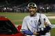 Kansas City Royals catcher Salvador Perez poses with his trophy after being named the MVP after Game 5 of the Major League Baseball World Series against the New York Mets Monday, Nov. 2, 2015, in New York. The Royals won 7-2 to win the series. (AP Photo/Matt Slocum)