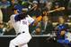 Oct 30, 2015; New York City, NY, USA; New York Mets center fielder Yoenis Cespedes (52) drives in a run with a sacrifice fly against the Kansas City Royals in the sixth inning in game three of the World Series at Citi Field. Mandatory Credit: Anthony Gruppuso-USA TODAY Sports
