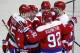 Washington Capitals left wing Andre Burakovsky, left, from Austria, right wing Justin Williams, defenseman Matt Niskanen, defenseman Karl Alzner and center Evgeny Kuznetsov, from Russia, gather to celebrate a goal by Williams in the third period of an NHL hockey game, Sunday, Jan. 17, 2016, in Washington. Williams later had a hat trick and the Capitals won 5-2. (AP Photo/Alex Brandon)