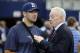 Dallas Cowboys owner Jerry Jones, right, talks with injured quarterback Tony Romo, left, before an NFL football game against the New England Patriots, Sunday, Oct. 11, 2015, in Arlington, Texas. (AP Photo/Brandon Wade)