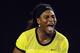 Serena Williams of the United States reacts after winning a point against Agnieszka Radwanska of Poland during their semifinal match at the Australian Open tennis championships in Melbourne, Australia, Thursday, Jan. 28, 2016.(AP Photo/Vincent Thian)
