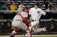 New York Yankees John Ryan Murphy scores on Brendan Ryan's second-inning, RBI single ahead of the throw to Boston Red Sox catcher Sandy Leon in a baseball game in New York, Thursday, Oct. 1, 2015. (AP Photo/Kathy Willens)