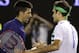 Novak Djokovic, left, of Serbia is congratulated by Roger Federer of Switzerland after their semifinal match at the Australian Open tennis championships in Melbourne, Australia, Thursday, Jan. 28, 2016.(AP Photo/Aaron Favila)