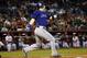 Colorado Rockies left fielder Corey Dickerson hits against the Arizona Diamondbacks during the first inning of a baseball game, Tuesday, Sept. 29, 2015, in Phoenix. (AP Photo/Matt York)
