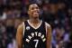 TORONTO, ON - JANUARY 28: Kyle Lowry #7 of the Toronto Raptors smiles late in the 4th quarter during an NBA game against the New York Knicks at the Air Canada Centre on January 28, 2016 in Toronto, Ontario, Canada. NOTE TO USER: User expressly acknowledges and agrees that, by downloading and or using this photograph, User is consenting to the terms and conditions of the Getty Images License Agreement. (Photo by Vaughn Ridley/Getty Images)