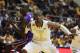 West Virginia forward Jonathan Holton (1) blocks out LSU forward John Odo (31) during an NCAA college basketball game, Thursday, Dec. 4, 2014, in Morgantown, W.Va. (AP Photo/Raymond Thompson)