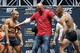 UFC president Dana White, center, stands between Conor McGregor, right, and Jose Aldo during the weigh-in for UFC 194 Friday, Dec. 11, 2015, in Las Vegas. McGregor and Aldo are scheduled to fight in a featherweight championship bout Saturday in Las Vegas. (AP Photo/John Locher)