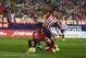 Barcelona's Neymar, left, vies for the ball with Atletico Madrid's Gabriel Fernandez “Gabi” during a Spanish La Liga soccer match between Atletico Madrid and Barcelona at the Vicente Calderon stadium in Madrid, Saturday, Sept. 12, 2015. Neymar scored once in Barcelona's 2-1 victory. (AP Photo/Francisco Seco)
