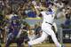 October 9, 2015; Los Angeles, CA, USA; Los Angeles Dodgers shortstop Corey Seager (5) hits a ground rule double in the third inning against the New York Mets in game one of the NLDS at Dodger Stadium. Mandatory Credit: Richard Mackson-USA TODAY Sports