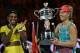 Germany's Angelique Kerber (R) holds The Daphne Akhurst Memorial Cup as she celebrates after victory in her women's singles final match against Serena Williams of the US (L) on day thirteen of the 2016 Australian Open tennis tournament in Melbourne on January 30, 2016. AFP PHOTO / SAEED KHAN-- IMAGE RESTRICTED TO EDITORIAL USE - STRICTLY NO COMMERCIAL USE / AFP / SAEED KHAN (Photo credit should read SAEED KHAN/AFP/Getty Images)