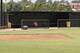 This photo shows an empty dugout on the baseball field at East Central University in Ada, Okla., Wednesday, Aug. 21, 2013. Australian Christopher Lane, who was on a baseball scholarship at East Central University was in Duncan, Okla., visiting his girlfriend, when he was shot and killed. (AP Photo/Sue Ogrocki)