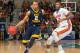 West Virginia guard Jevon Carter (2) dribbles past Florida forward Dorian Finney-Smith (10) during the first half of an NCAA college basketball game, Saturday, Jan. 30, 2016, in Gainesville, Fla. (AP Photo/Ronald Irby)
