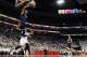 Jan 30, 2016; Louisville, KY, USA; Virginia Cavaliers forward Anthony Gill (13) dunks against Louisville Cardinals guard Damion Lee (0) during the first half at KFC Yum! Center. Mandatory Credit: Jamie Rhodes-USA TODAY Sports