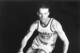 FILE - In this 1950 file photo, the Denver Nuggets' Kenny Sailors dribbles a basketball. Sailors, a College basketball Hall of Famer and the man credited by some with being the first to use the modern jump shot, died in his sleep early Saturday, Jan. 30, 2016, at an assisted living center in Laramie, Wyo., the University of Wyoming announced. He was 95. (AP Photo/File)