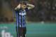 Inter Milan's Mauro Icardi grimaces after missing a penalty kick during a Serie A soccer match between AC Milan and Inter Milan, at the San Siro stadium in Milan, Italy, Sunday, Jan. 31, 2016. (AP Photo/Luca Bruno)