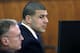 FILE - In this Thursday, April 9, 2015, file photo, former New England Patriots football player Aaron Hernandez, right, sits with defense attorney Charles Rankin, left, before the jury began deliberations in his murder trial in Fall River, Mass. Hernandez was convicted of murder and sentenced to life imprisonment for the 2013 shooting death of Odin Lloyd. The story was a top news item in Massachusetts in 2015. (AP Photo/Steven Senne, Pool, File)