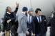 Carolina Panthers' Cam Newton jumps into a picture being taken of Luke Kuechly, right to left, Greg Olsen and Derek Anderson after getting off the plane at the Mineta San Jose International Airport as they arrive for the NFL Super Bowl football game Sunday, Jan. 31, 2016, in San Jose, Calif. The Panthers play the Denver Broncos on Sunday, Feb. 7, 2015, in Super Bowl 50. (AP Photo/David J. Phillip)