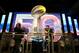NFL fans pose for a photo with the Lombardi Trophy at an exhibit at NFLX on Sunday, January 31, 2106 in San Francisco, CA. (Gregory Payan/AP Images for NFL)