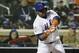 New York Mets' Juan Uribe hits an RBI single during the sixth inning of Game 3 of the Major League Baseball World Series against the Kansas City Royals Friday, Oct. 30, 2015, in New York. (AP Photo/David J. Phillip)
