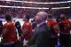 Anaheim Ducks head coach Bruce Boudreau, center, listens to the national anthem before an NHL hockey game with the Nashville Predators, Sunday, Nov. 1, 2015, in Anaheim, Calif. (AP Photo/Jae C. Hong)