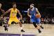 Dallas Mavericks' Deron Williams, right, dribbles the ball while Los Angeles Lakers' Nick Young, left, defends him during the first half of an NBA basketball game, Tuesday, Jan. 26, 2016, in Los Angeles. (AP Photo/Danny Moloshok)