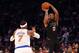 Jan 29, 2016; New York, NY, USA; Phoenix Suns forward P.J. Tucker (17) shoots over New York Knicks forward Carmelo Anthony (7) during the first quarter at Madison Square Garden. Mandatory Credit: Anthony Gruppuso-USA TODAY Sports