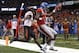Mississippi wide receiver Laquon Treadwell (1) scores a touchdown as Oklahoma State cornerback Darius Curry covers in the second half of the Sugar Bowl college football game in New Orleans, Friday, Jan. 1, 2016. (AP Photo/Jonathan Bachman)