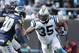 Carolina Panthers fullback Mike Tolbert (35) runs against Seattle Seahawks cornerback Jeremy Lane (20) during the first half of an NFL divisional playoff football game, Sunday, Jan. 17, 2016, in Charlotte, N.C. (AP Photo/Bob Leverone)