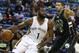 New Orleans Pelicans guard Tyreke Evans (1) drives against Milwaukee Bucks guard Michael Carter-Williams (5) during the second half of an NBA basketball game Saturday, Jan. 23, 2016, in New Orleans. The Pelicans won 116-99. (AP Photo/Jonathan Bachman)
