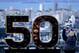 A man takes a photo of a Super Bowl 50 sign at Twin Peaks park overlooking San Francisco Thursday, Feb. 4, 2016. (AP Photo/Charlie Riedel)