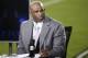 Former football player Deion Sanders is seen on a broadcast stage before an NFL football game between the Philadelphia Eagles and the Washington Redskins, Saturday, Dec. 26, 2015, in Philadelphia. (AP Photo/Matt Rourke)