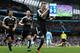 Leicester City's German defender Robert Huth (R) celebrates scoring his team's third goal with Leicester City's Japanese striker Shinji Okazaki (L) and Leicester City's Algerian midfielder Riyad Mahrez during the English Premier League football match between Manchester City and Leicester City at the Etihad Stadium in Manchester, north west England, on February 6, 2016. / AFP / ADRIAN DENNIS / RESTRICTED TO EDITORIAL USE. No use with unauthorized audio, video, data, fixture lists, club/league logos or 'live' services. Online in-match use limited to 75 images, no video emulation. No use in betting, games or single club/league/player publications. / (Photo credit should read ADRIAN DENNIS/AFP/Getty Images)