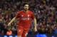 Liverpool's Welsh midfielder Joe Allen celebrates scoring the winning penalty in the shoot-out after the English League Cup semi-final second leg football match between Liverpool and Stoke City at Anfield in Liverpool, north west England, on January 26, 2016. Liverpool won the two legged semi-final 6-5 on penalties, after a 1-0 Stoke victory in 90 minutes meant the tie finished 1-1 after extra time. / AFP / Paul ELLIS / RESTRICTED TO EDITORIAL USE. No use with unauthorized audio, video, data, fixture lists, club/league logos or 'live' services. Online in-match use limited to 75 images, no video emulation. No use in betting, games or single club/league/player publications. / (Photo credit should read PAUL ELLIS/AFP/Getty Images)